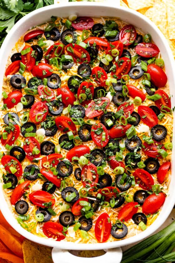 overhead shot of a white baking dish with seven layer mexican dip