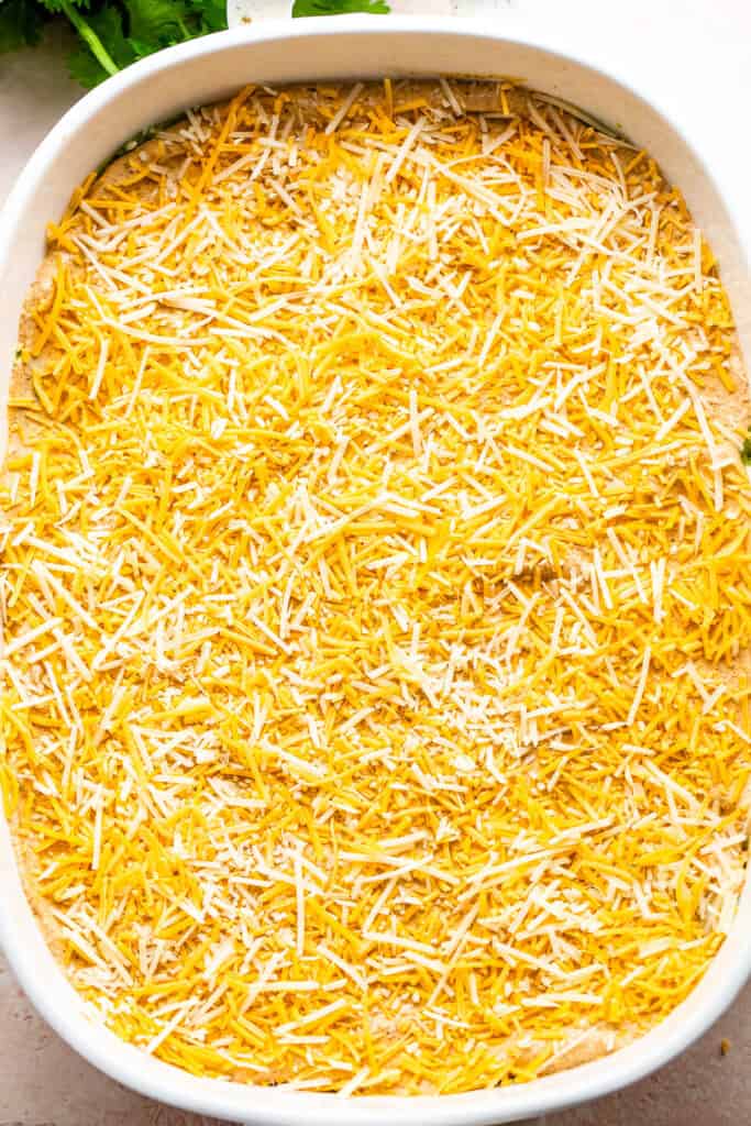 shredded cheese layered over sour cream