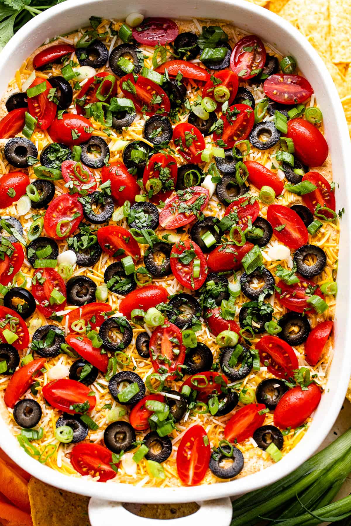 overhead shot of a white baking dish with seven layer mexican dip