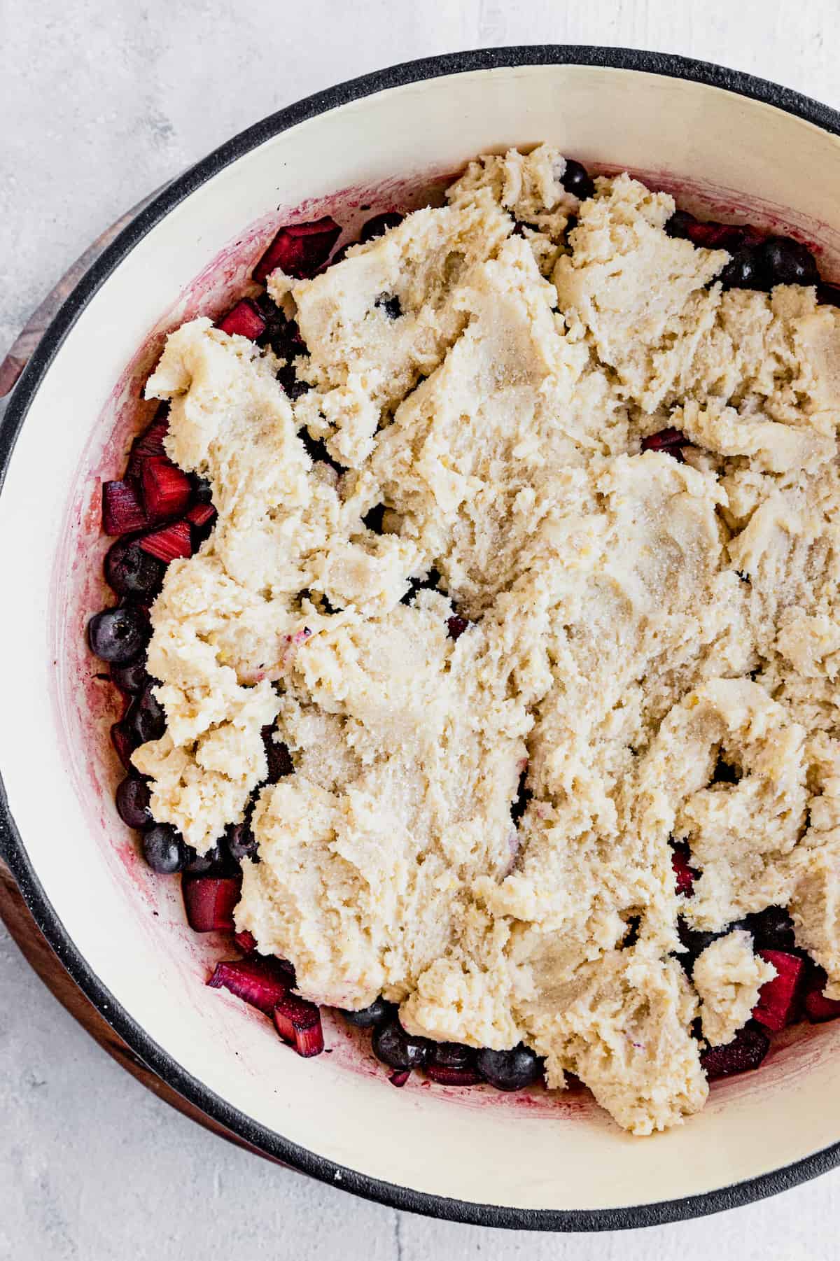 Sweet-Tart Blueberry Rhubarb Cobbler 9 A Pan Filled with the Crisp Filling and Covered with the Dough for the Topping