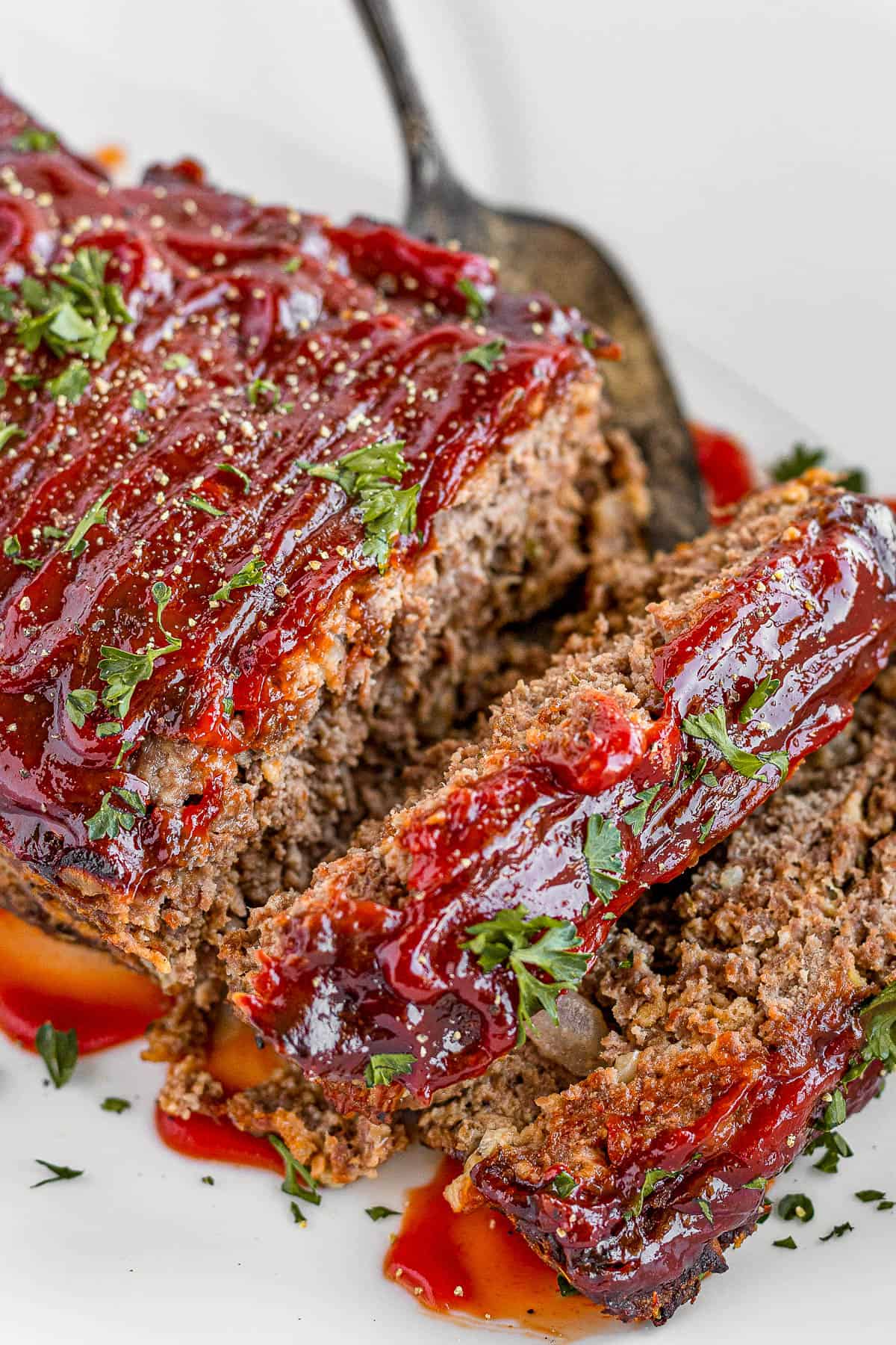 Meatloaf Covered in Barbecue Sauce on a White Serving Platter