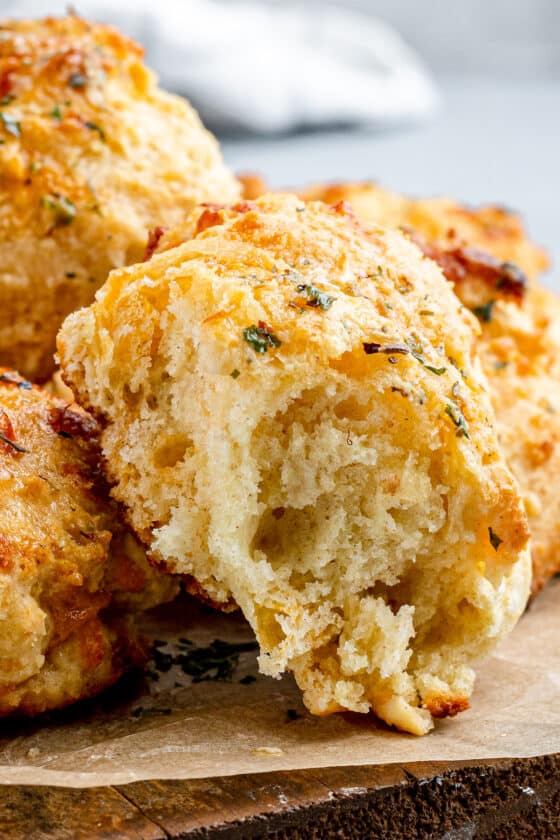 An Air Fryer Red Lobster Biscuit with a Bite Taken Out to Reveal the Fluffy Interior