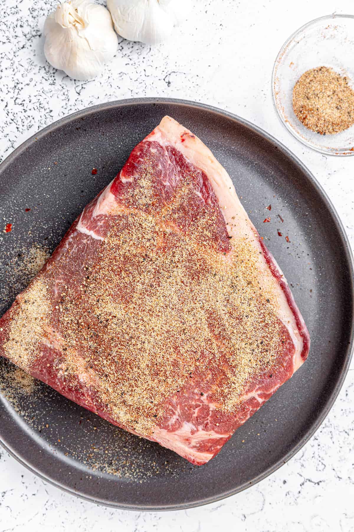 Seasoned chuck roast ready for browning.
