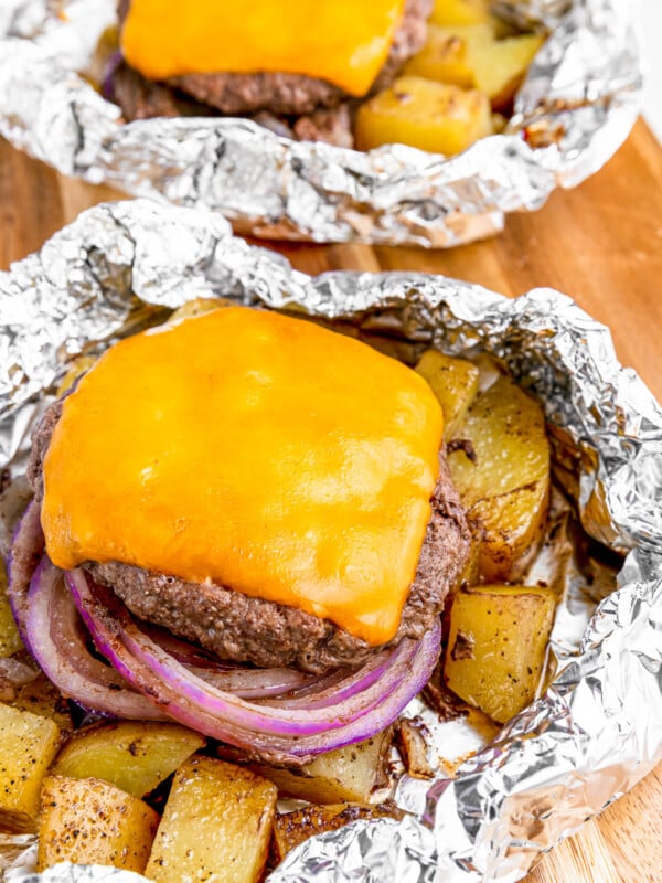 Cheeseburger in foil with melted cheese