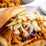 sandwich buns with pulled pork topped with coleslaw