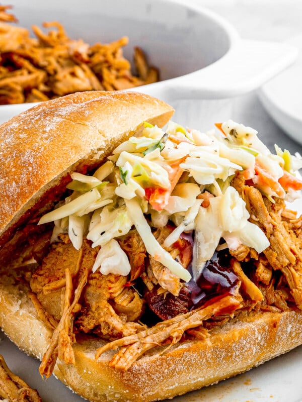 sandwich buns with pulled pork topped with coleslaw