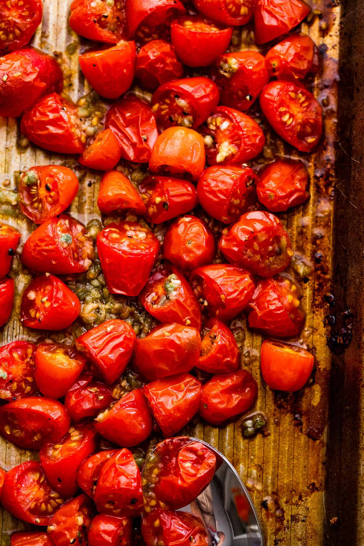 roasted cherry tomatoes on a baking sheet