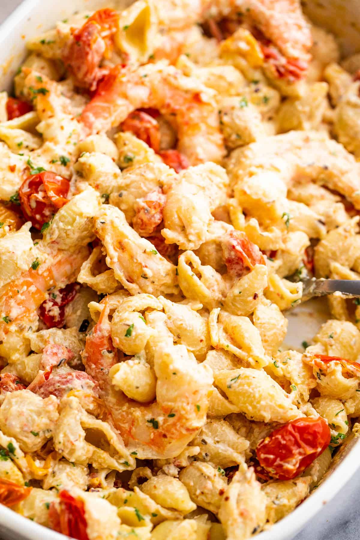 shrimp and pasta tossed with a cream cheese sauce and cherry tomatoes