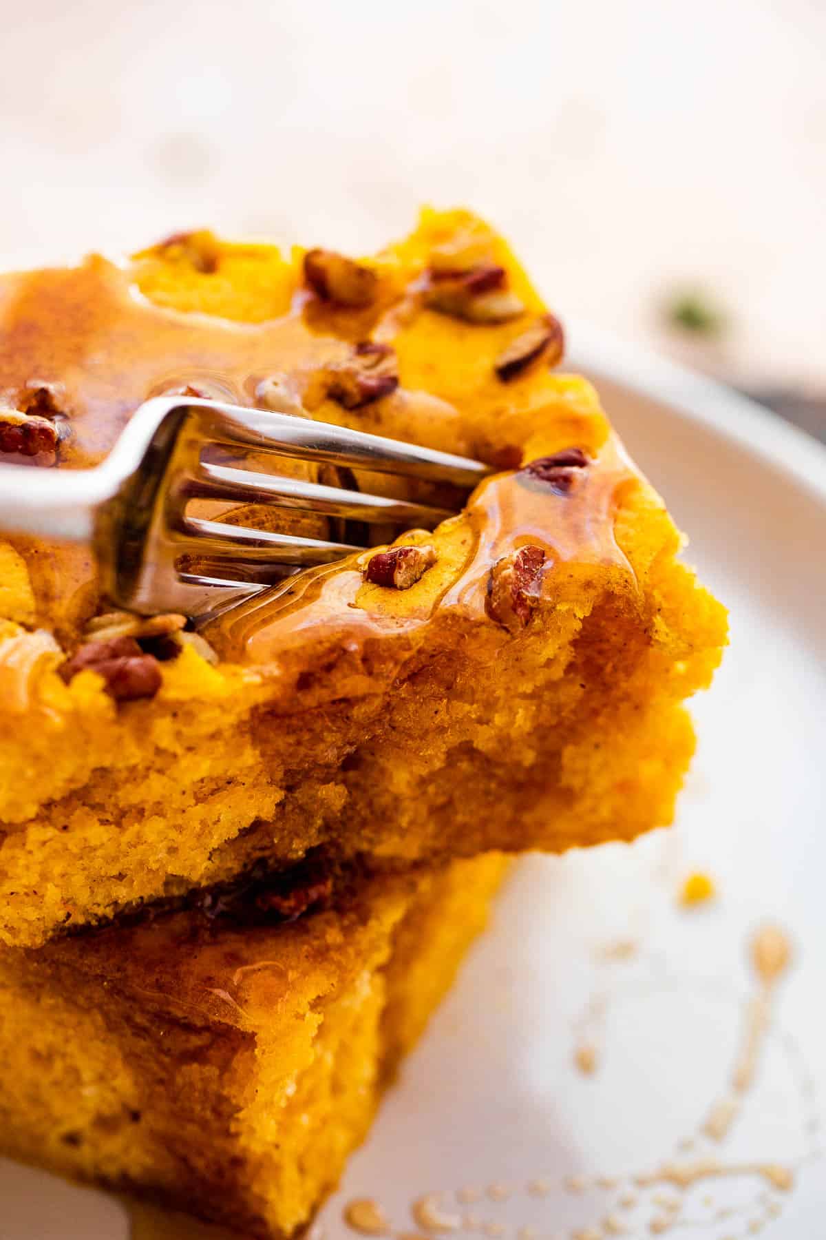 fork cutting into a pumpkin pancake