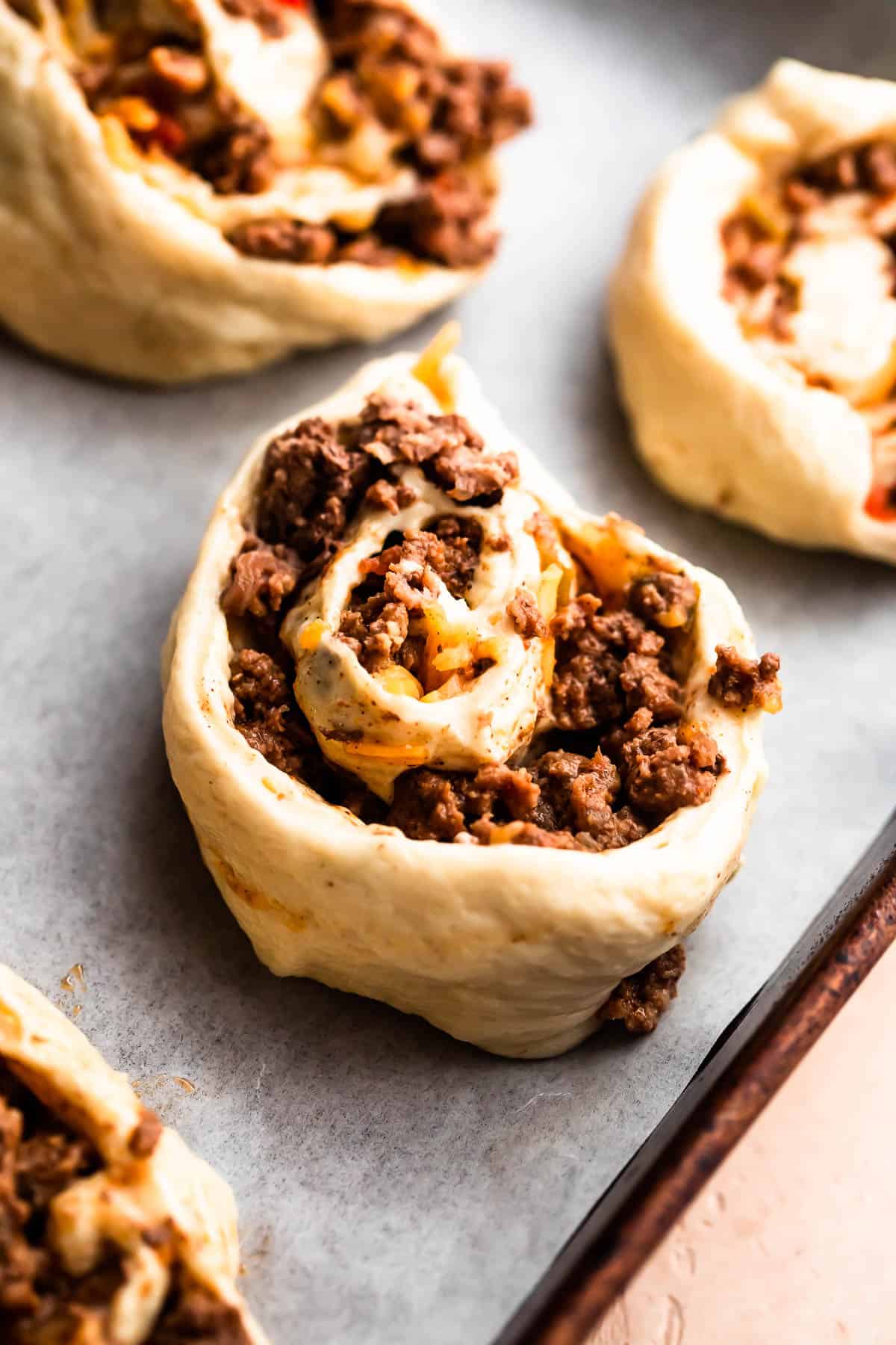 ground beef rolled up in pizza dough and cut into pinwheels.