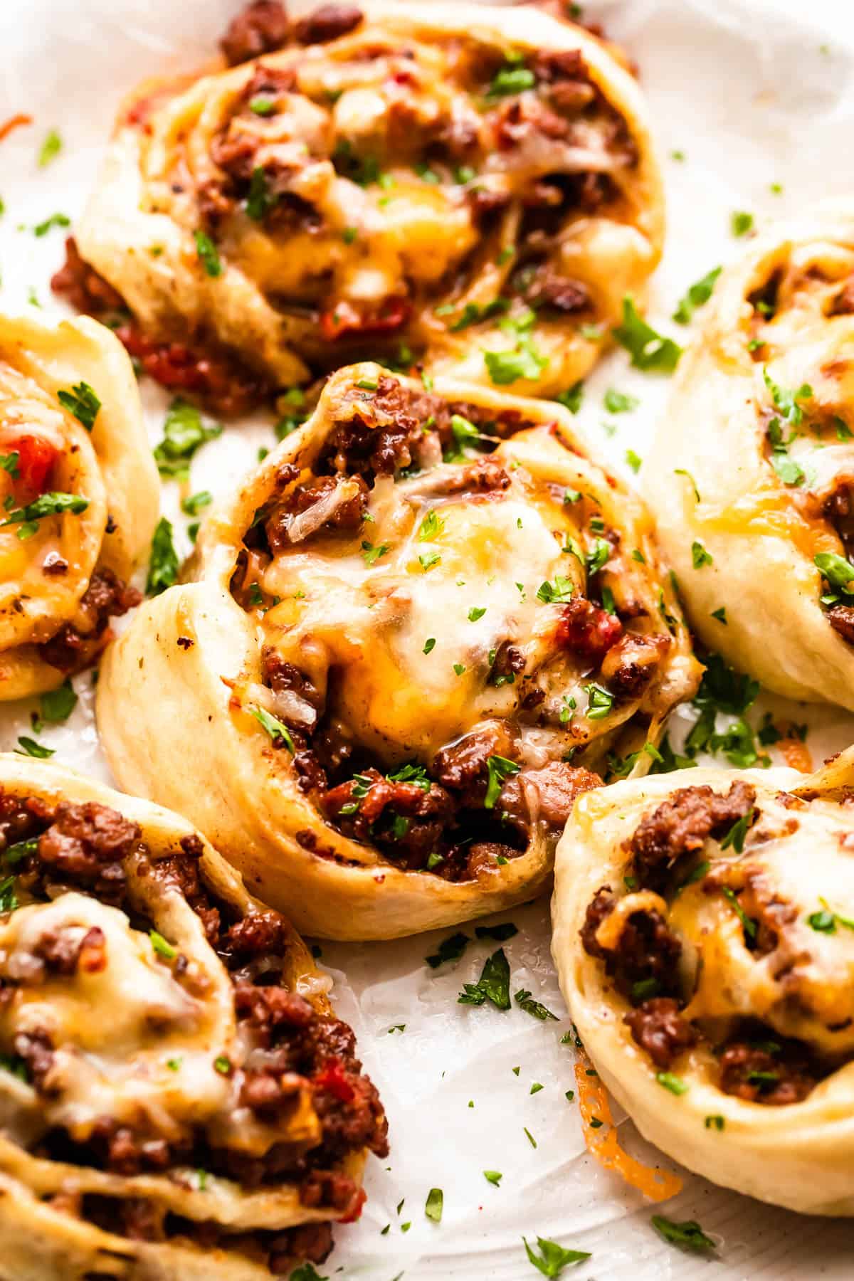 taco pinwheels served on a white background.