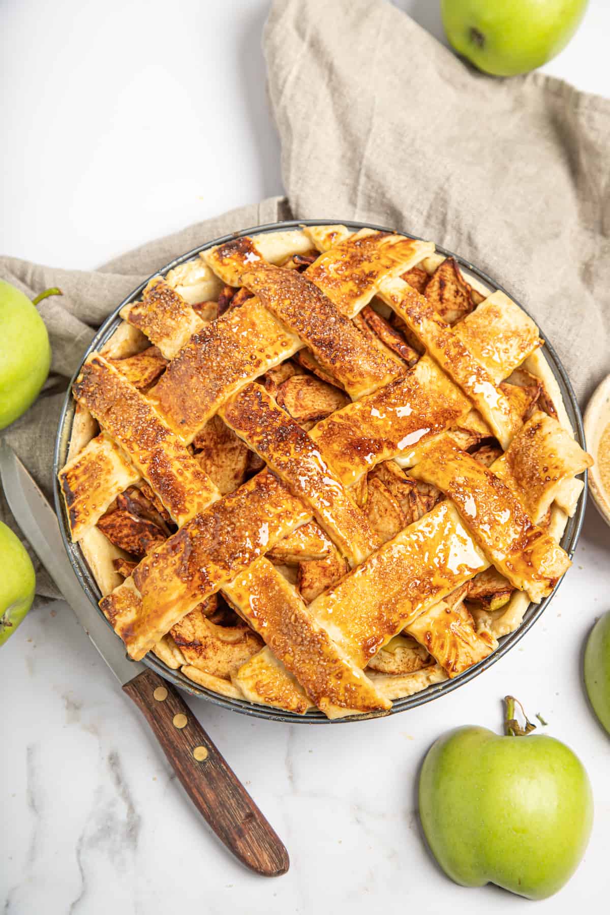 A homemade apple pie with a lattice top.