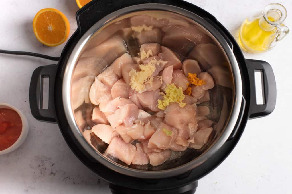 Cubed chicken in an Instant Pot.