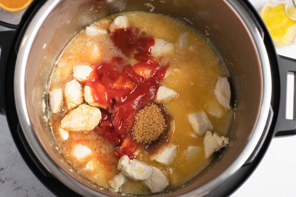 Chicken and sauce ingredients in the Instant Pot