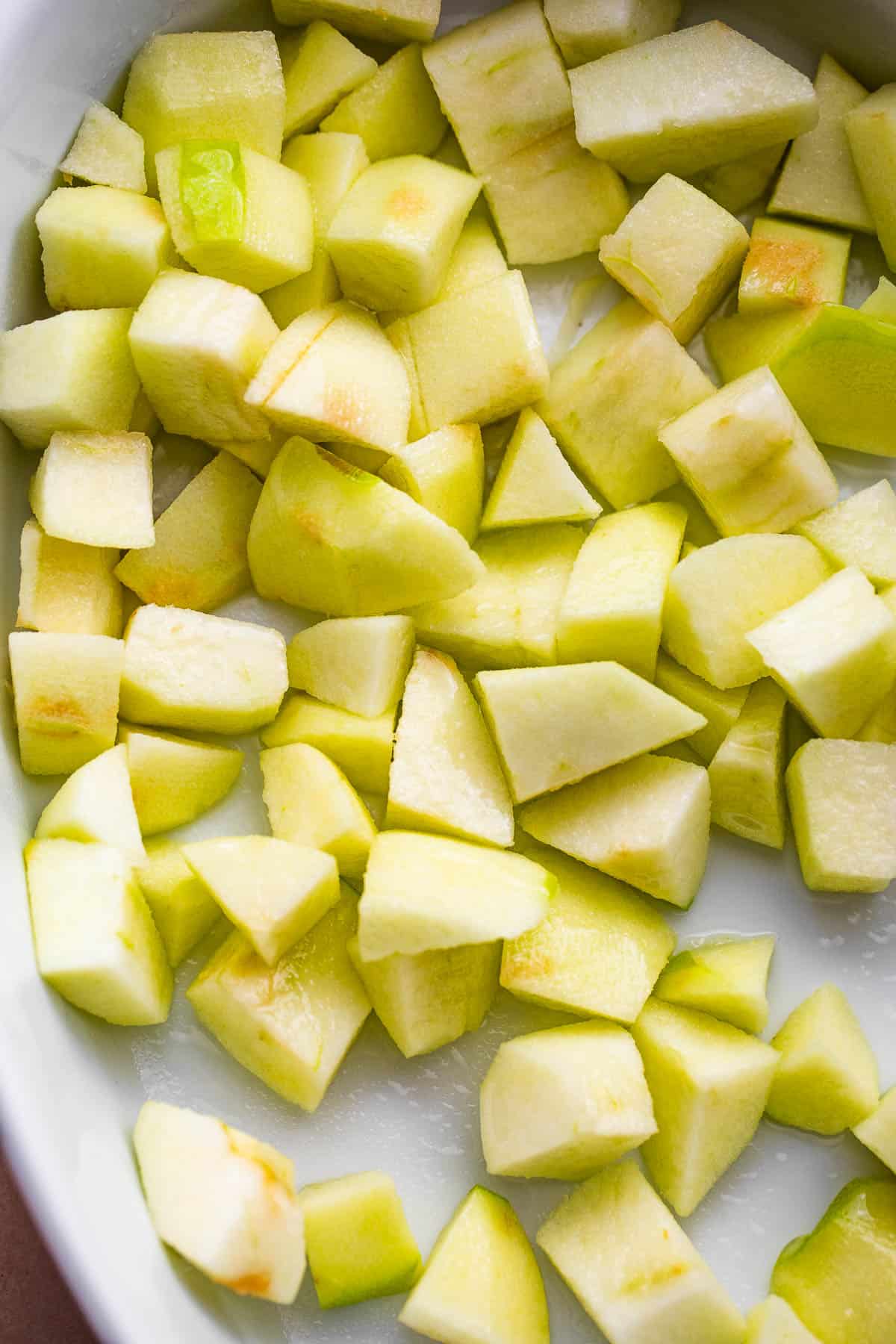 diced apple on a white background