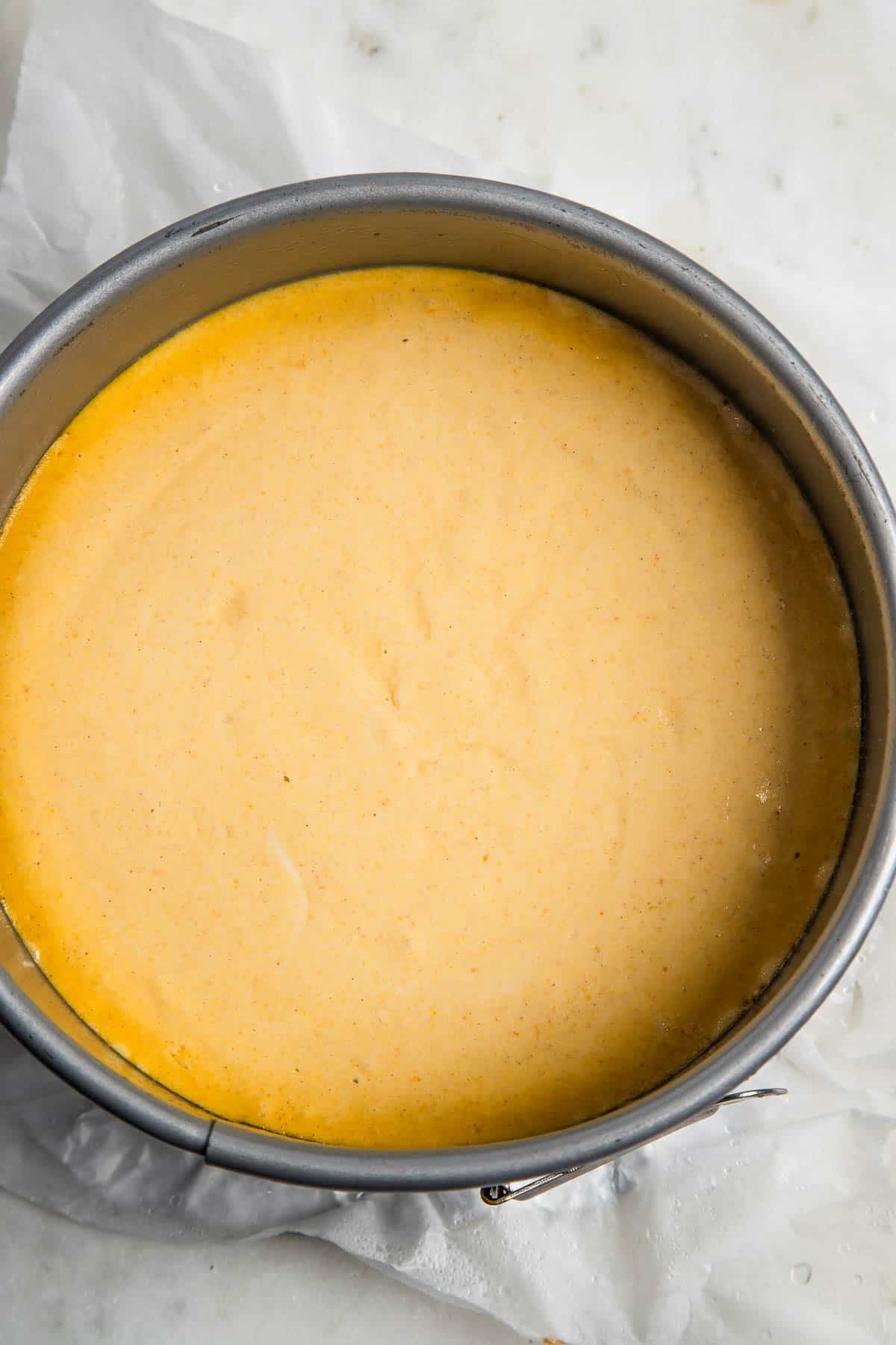 baked pumpkin cheesecake inside an instant pot insert.