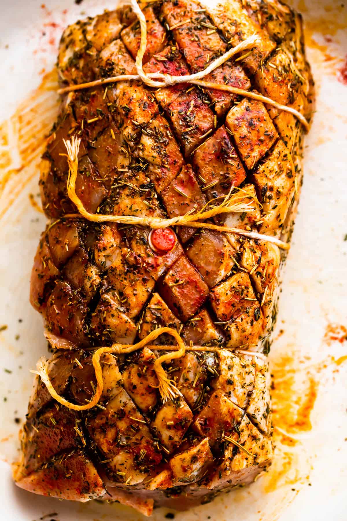 raw pork loin roast tied with kitchen twine