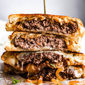 patty melt sandwich cut in halves and stacked up.