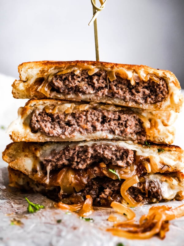 patty melt sandwich cut in halves and stacked up.