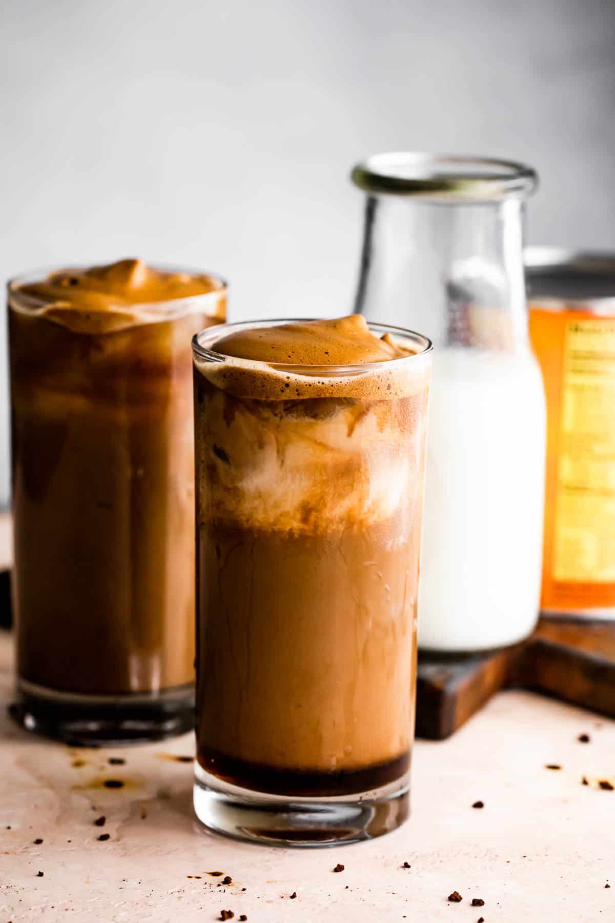 Pumpkin Cream Cold Brew served in two drinking glasses with a milk bottle placed right beside them.