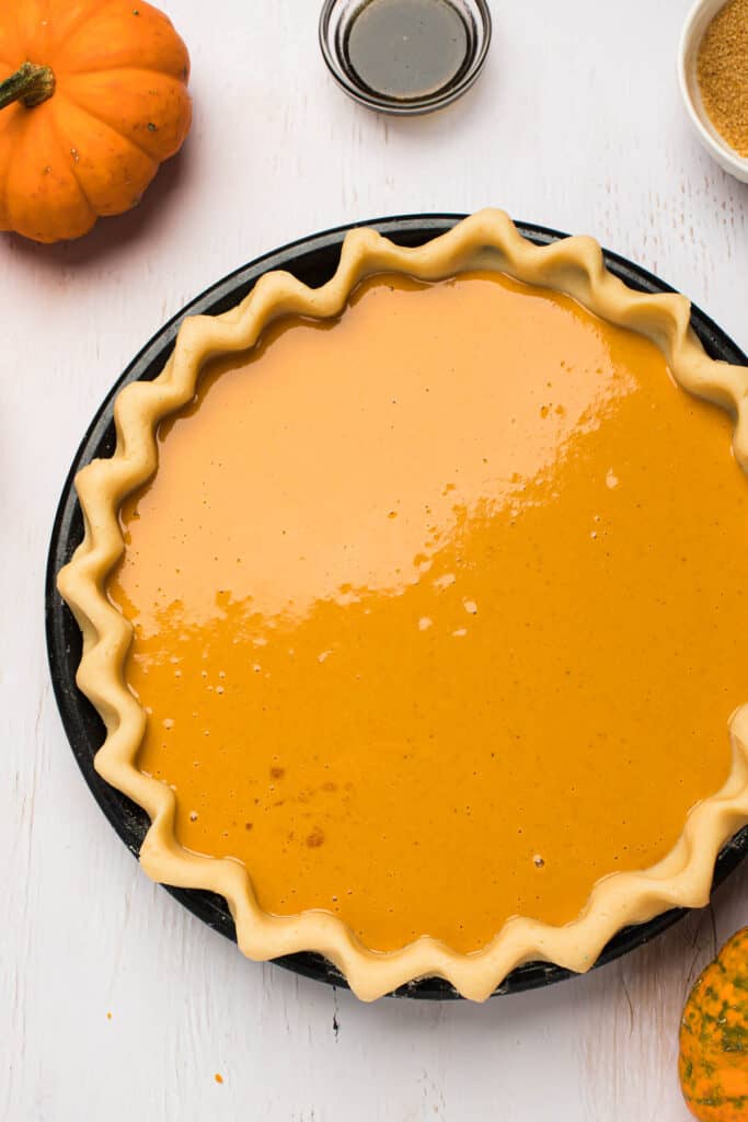 pie shell filled with pumpkin pie filling.
