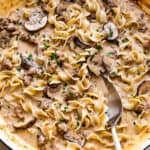 overhead shot of beef stroganoff with ground beef, noodles, and mushrooms.