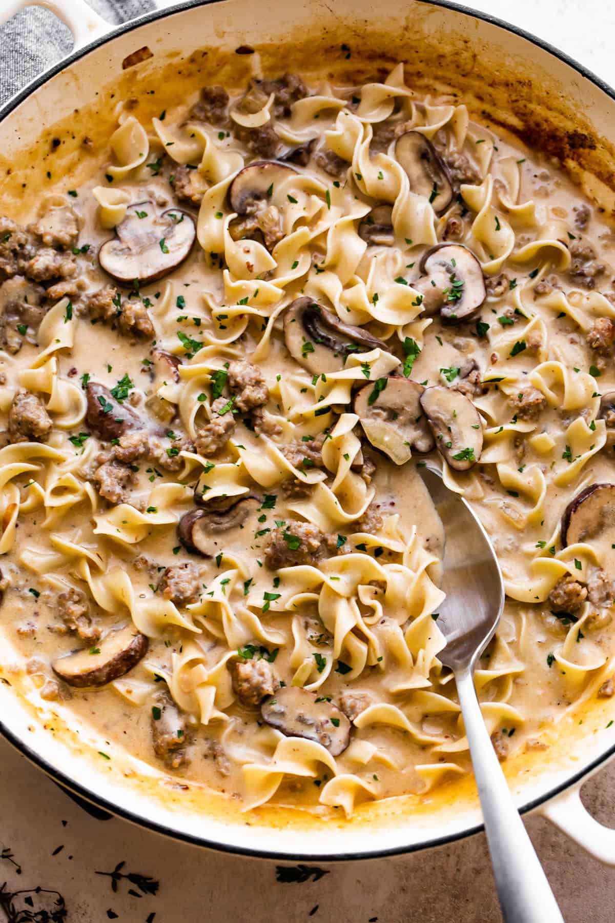 overhead shot of beef stroganoff with ground beef, noodles, and mushrooms.