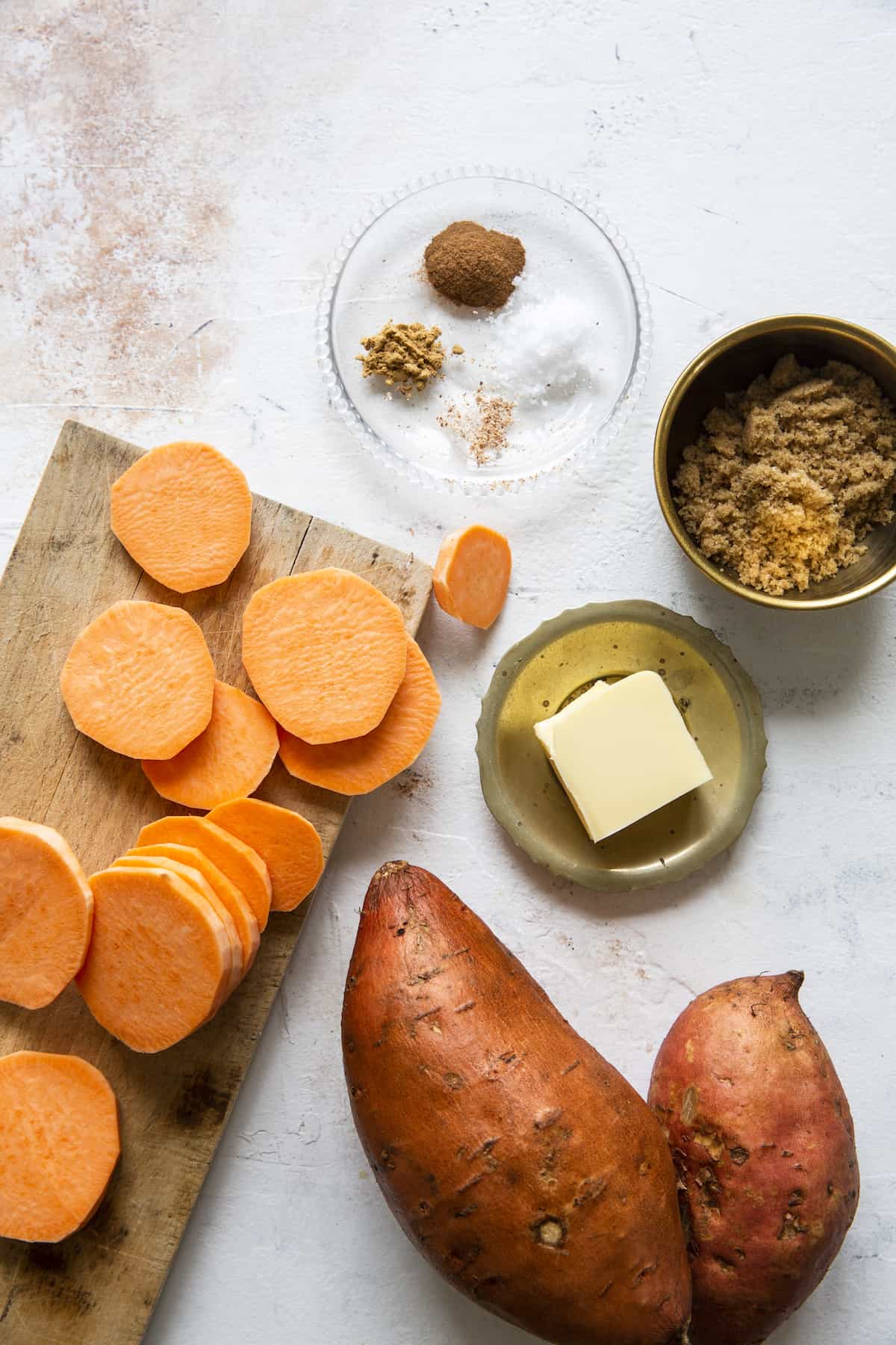 Clockwise from top: Cinnamon, ginger, nutmeg, and salt; brown sugar, butter, sweet potatoes.