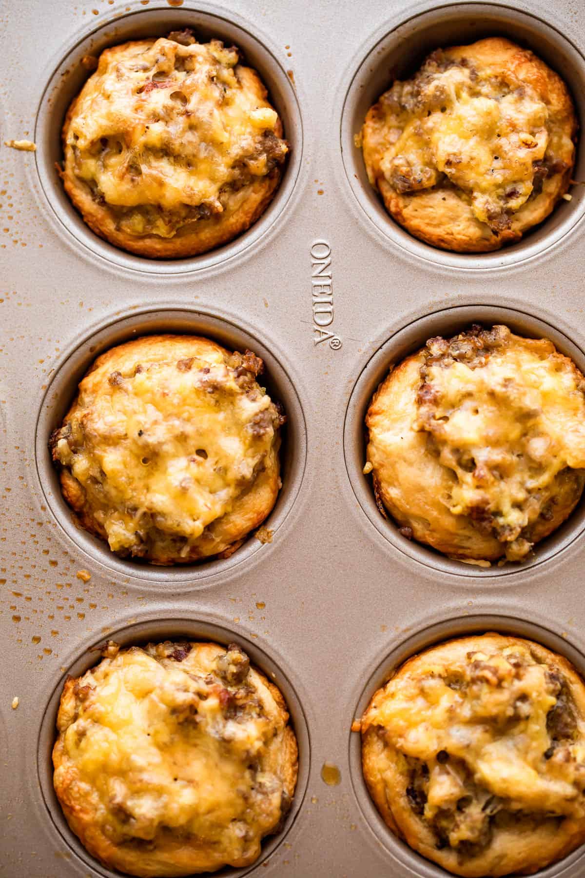 overhead picture of sausage breakfast cups in a muffin tin.