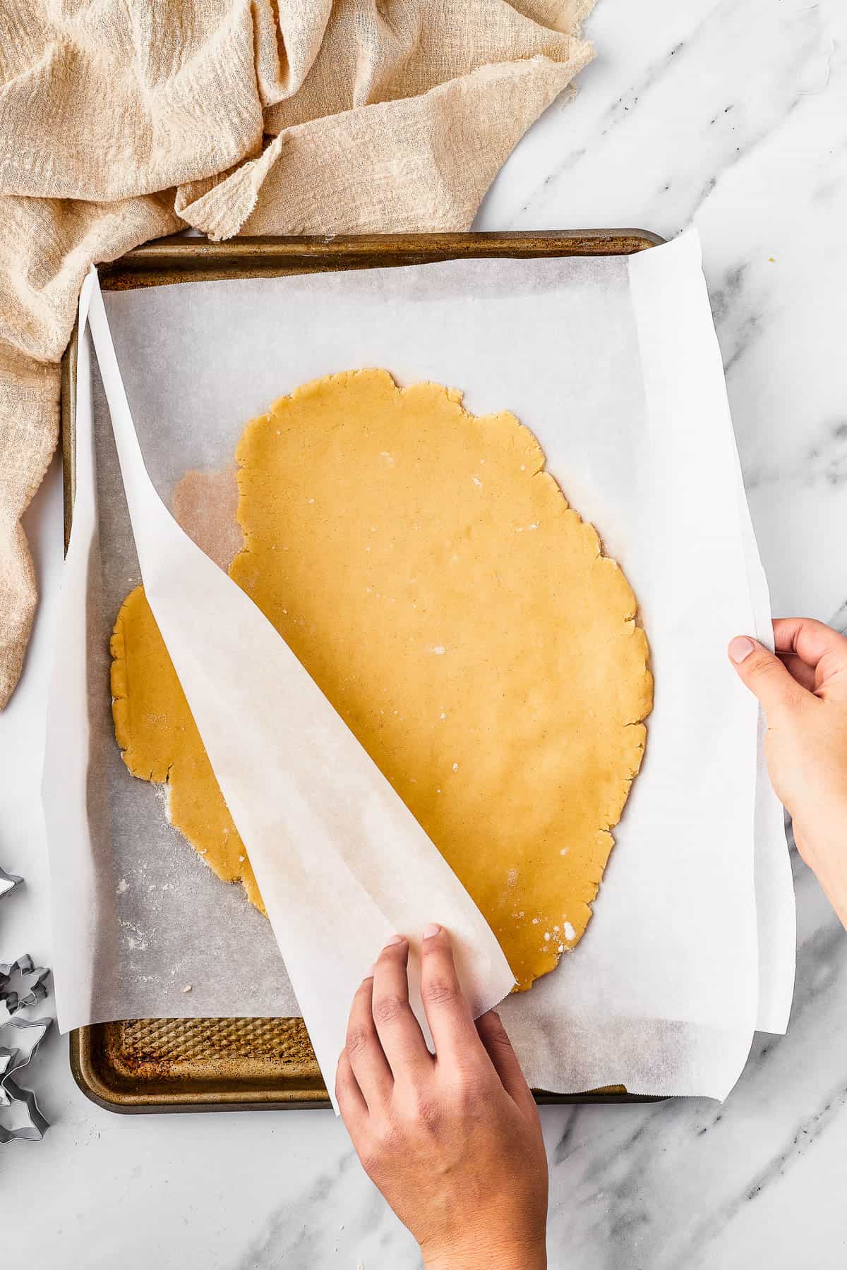 Rolled cookie dough on parchment.