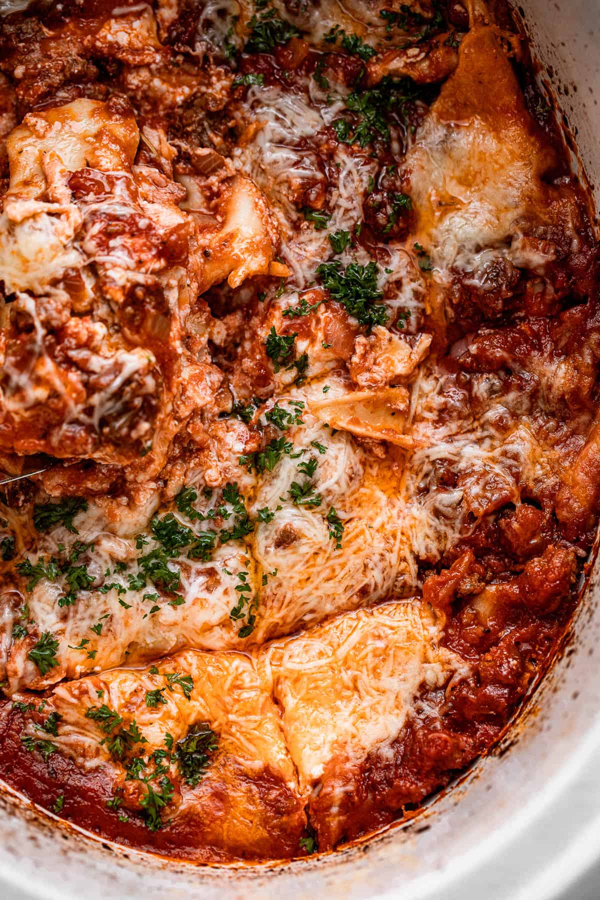 overhead shot of a lasagna inside a slow cooker pot.