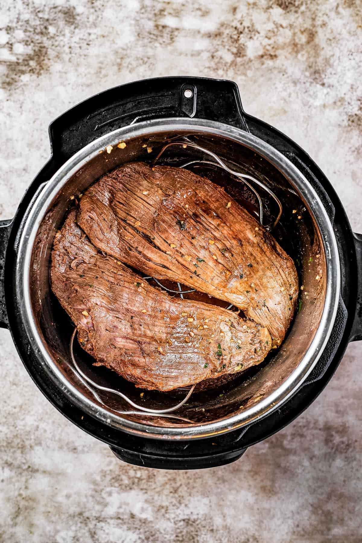 Flank steak browning in an Instant Pot.