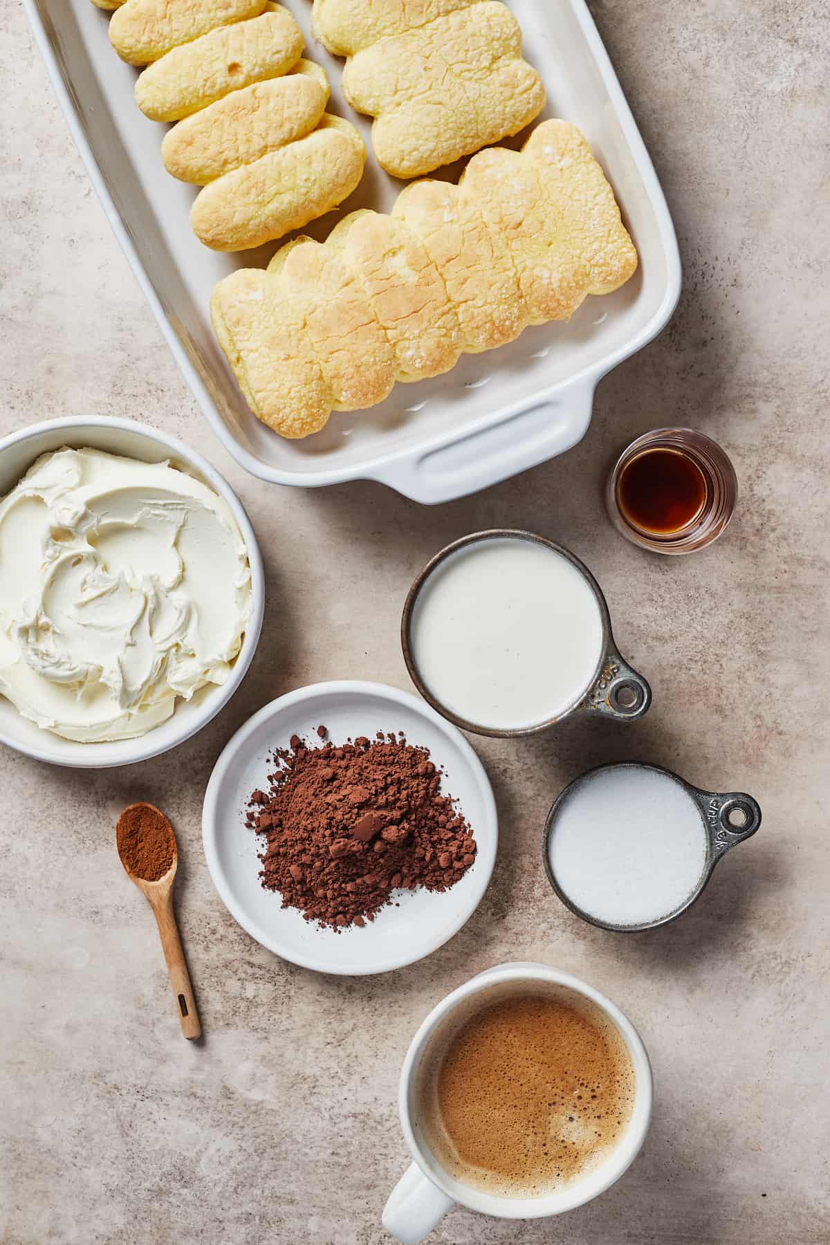 From top: Ladyfinger cookies, vanilla, whipping cream, sugar, espresso, cocoa powder, cinnamon, mascarpone cheese.