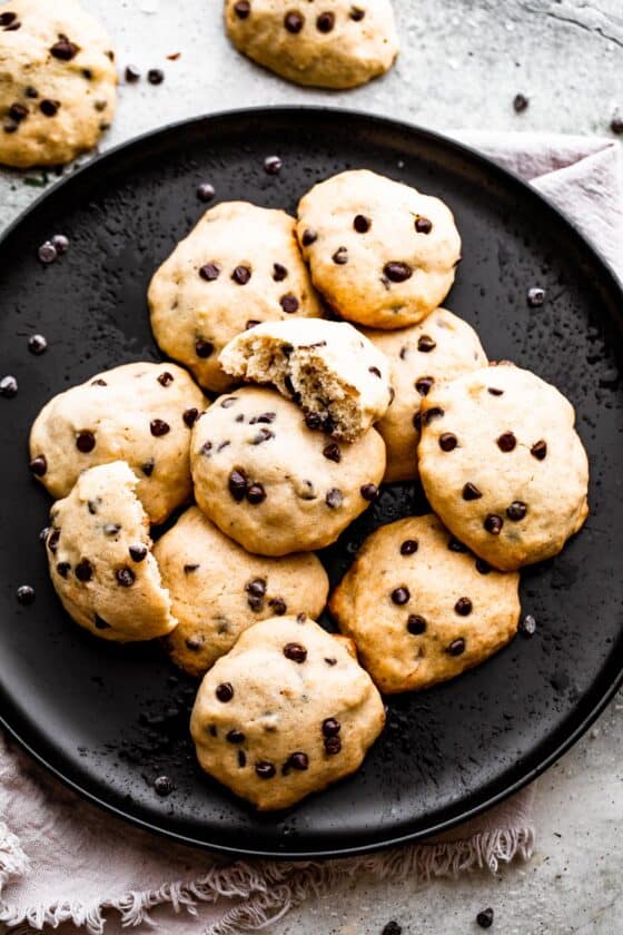 overhead shot of banana chocolate chips cookies served on a black plate.