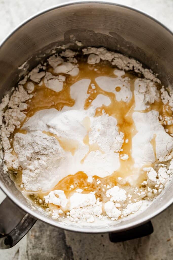 flour, oil, and yeast in a mixing bowl.
