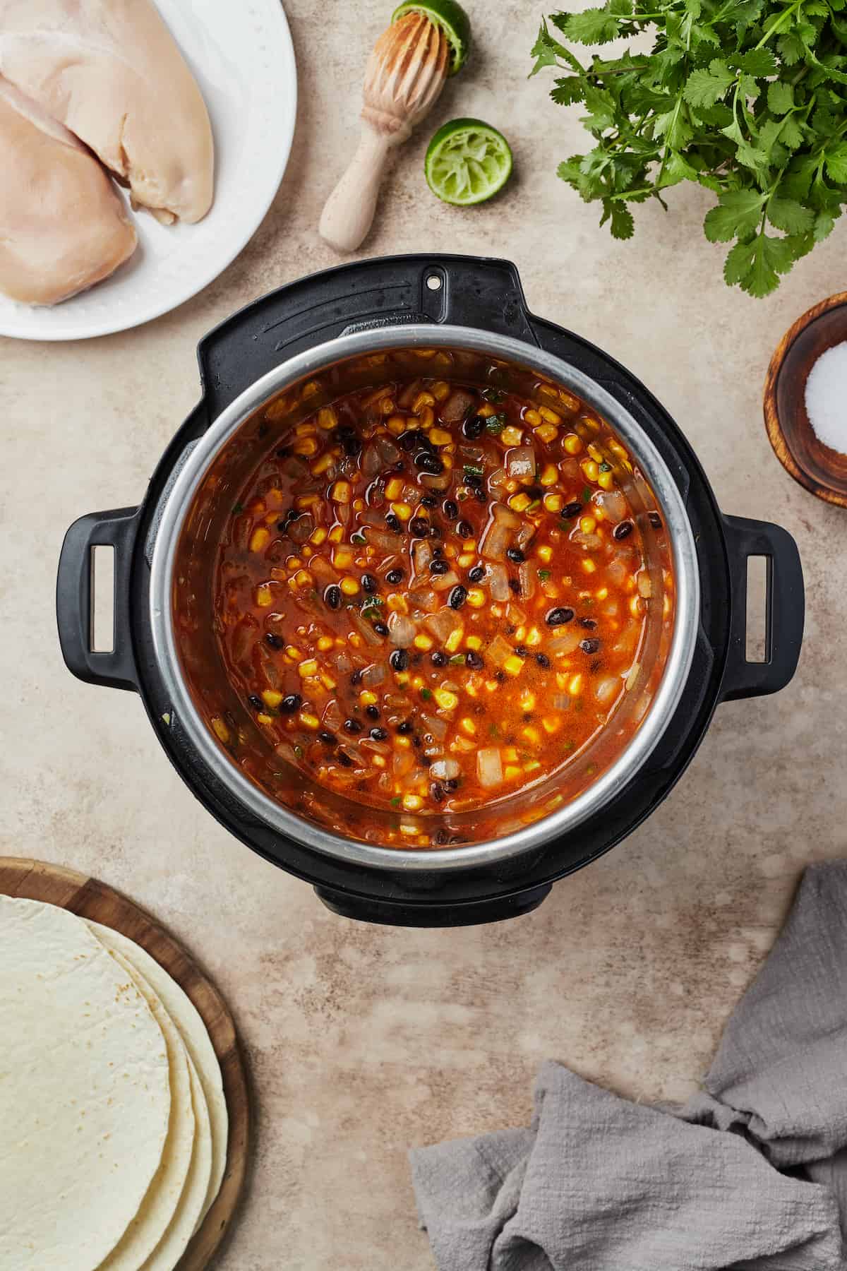 Vegetables, beans, and other ingredients in an Instant Pot.