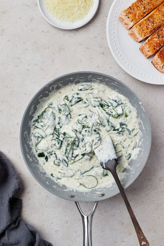 A creamy spinach sauce in a nonstick skillet.