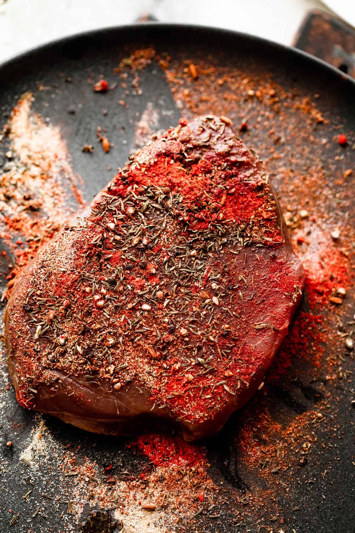 Raw tuna seasoned with a dry rub.