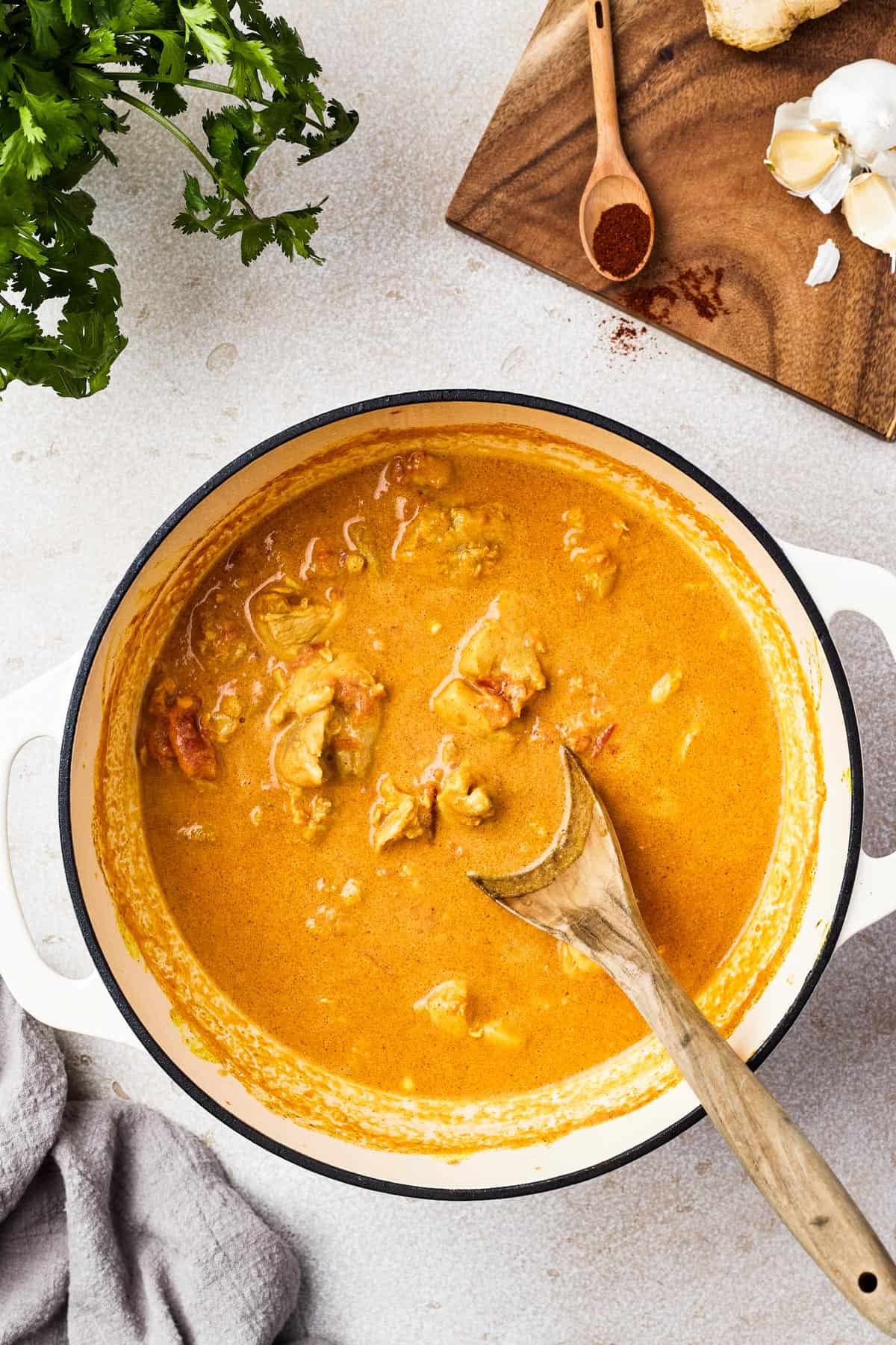 Creamy chicken curry in a heavy pot.