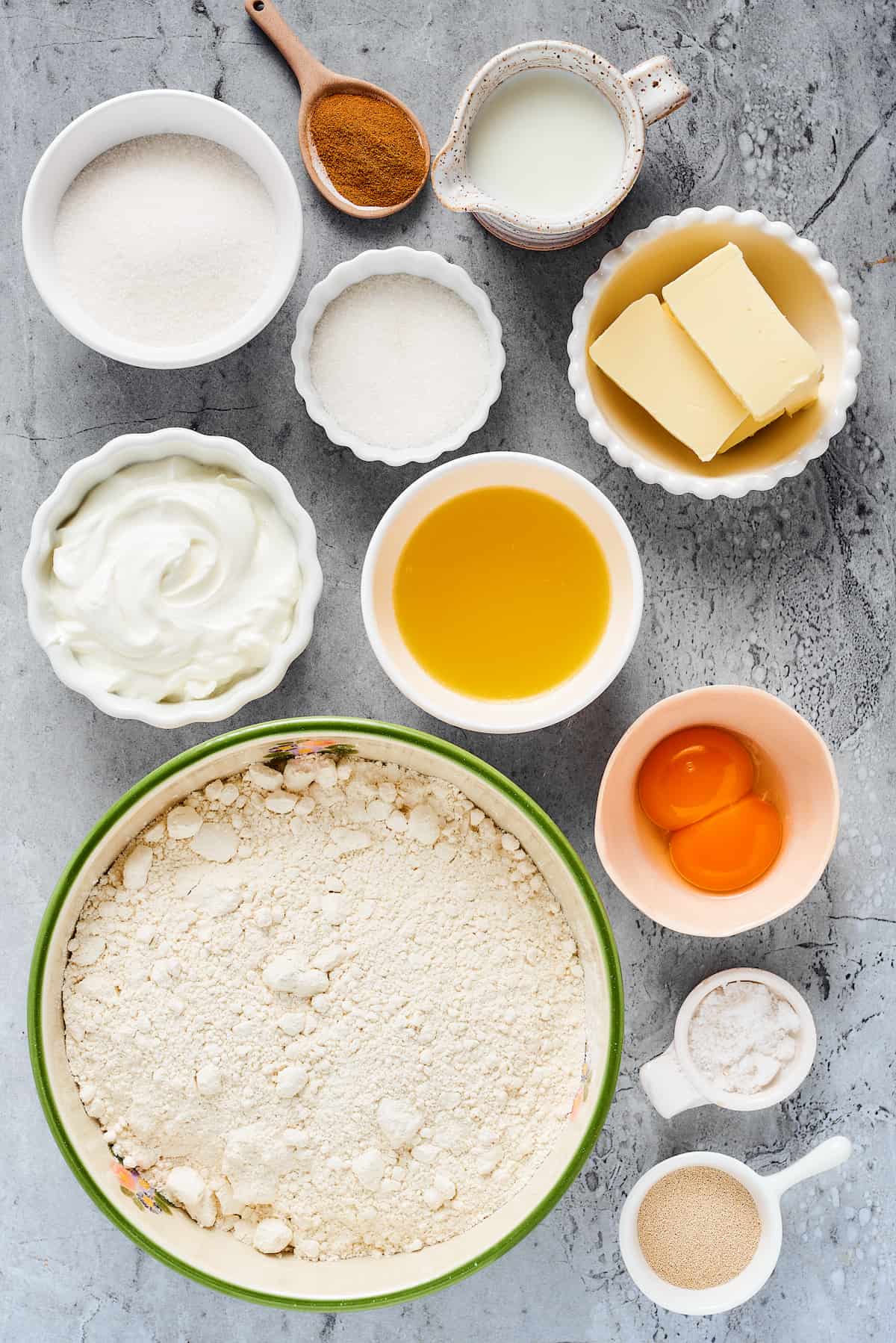 From top left: Sugar, cinnamon, milk, granulated sugar, butter, heavy cream, melted butter, melted butter, egg yolks, spelt flour, salt, instant yeast.