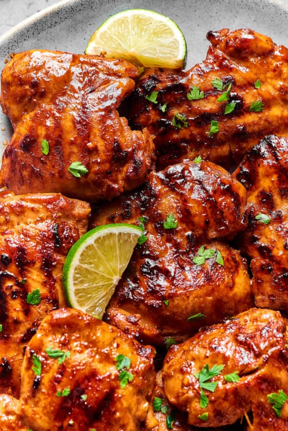 Grilled chicken thighs coated in a sticky sauce.