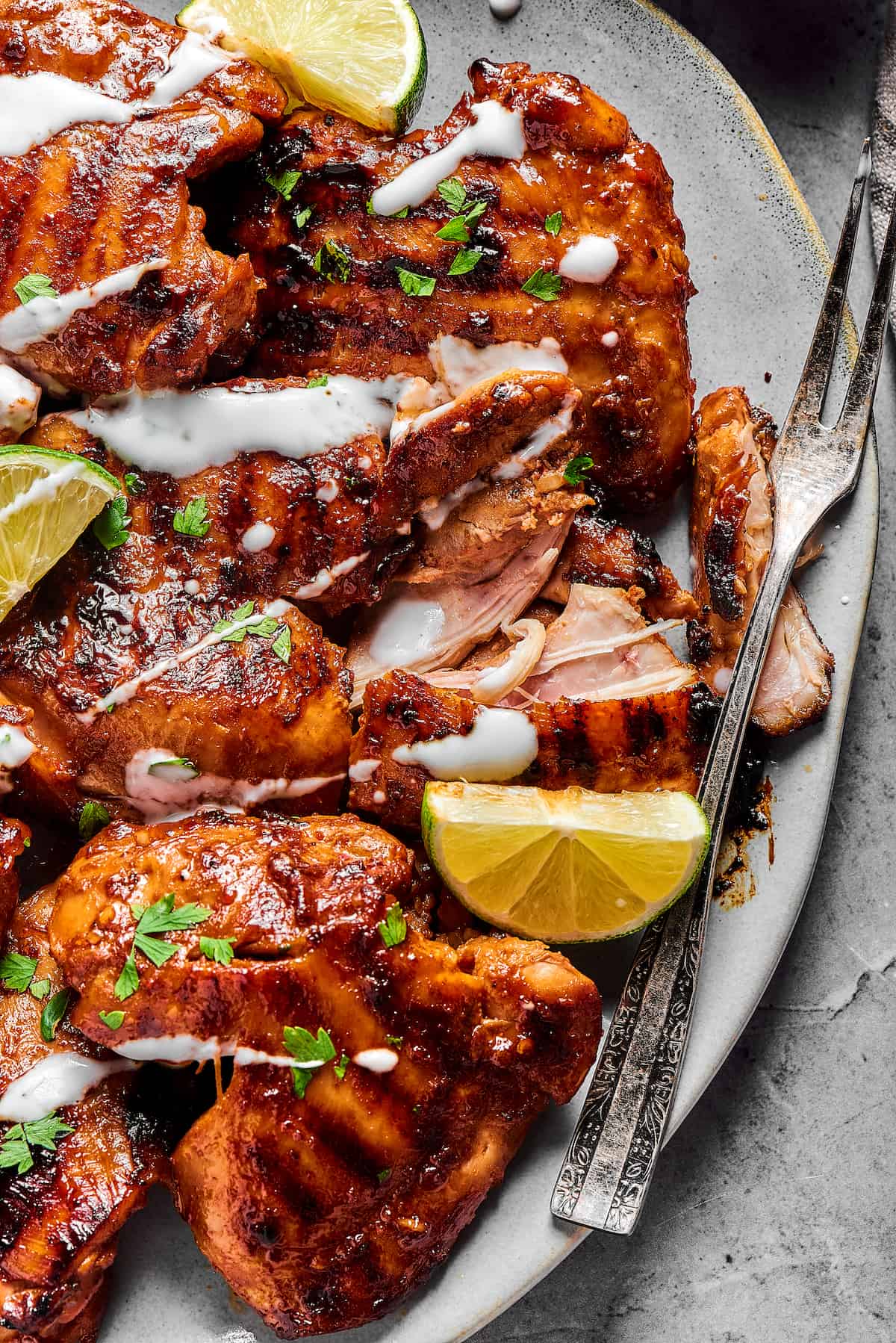 Yogurt-drizzled, marinated grilled chicken thighs.