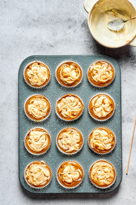 Unbaked pumpkin cream cheese muffins.