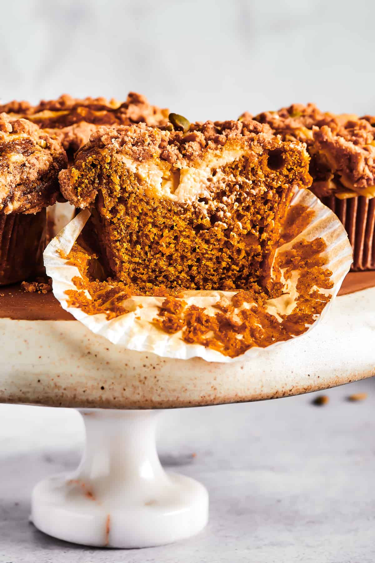 Pumpkin muffins arranged on a cake stand.