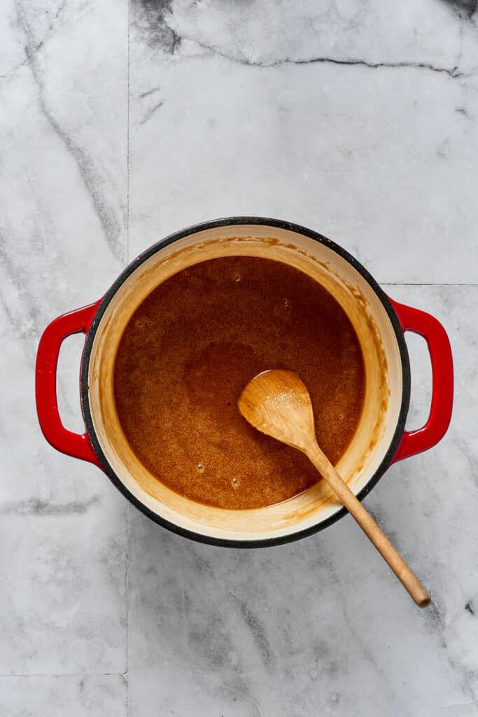 A sugar-syrup mixture in a saucepan.