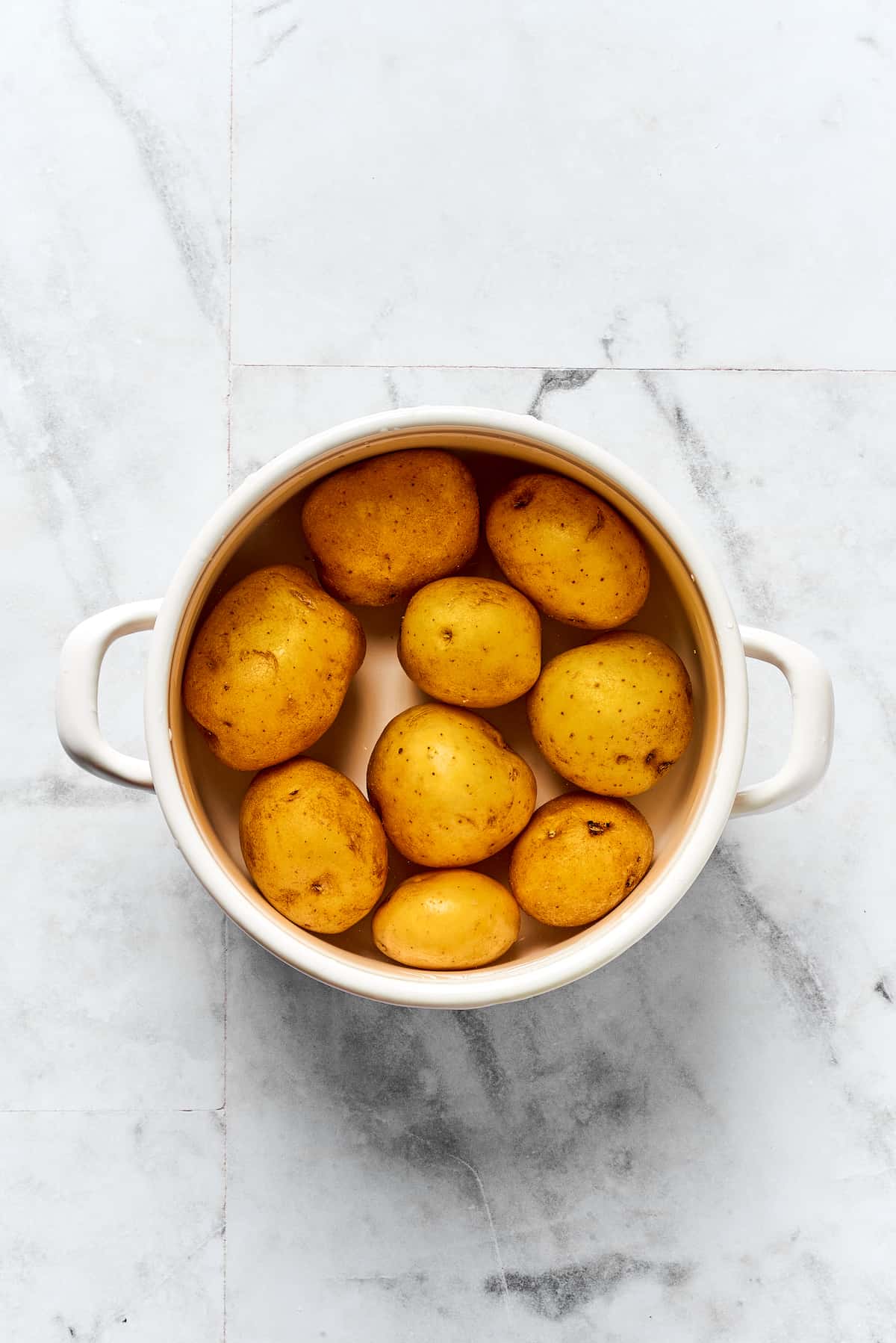 Potatoes cooking in a pot.