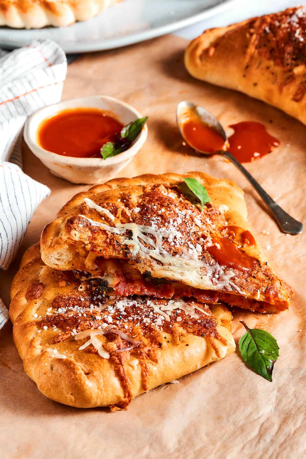 A pizza pocket cut in half to show the cheesy filling.