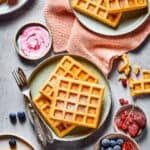 A tablescape with fresh fruit, homemade waffle recipe, and cloth napkins.