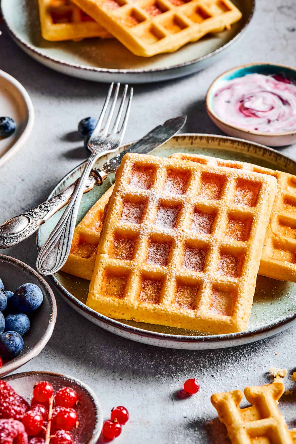Homemade waffles on a table.