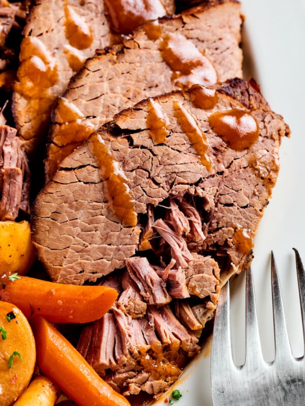 Pot roast with gravy and vegetables.